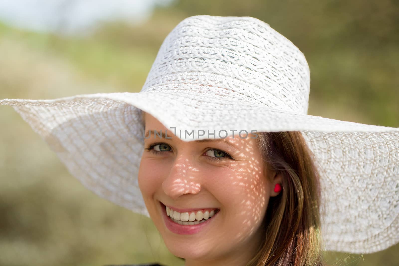 cheerful fashionable woman with hat by artush