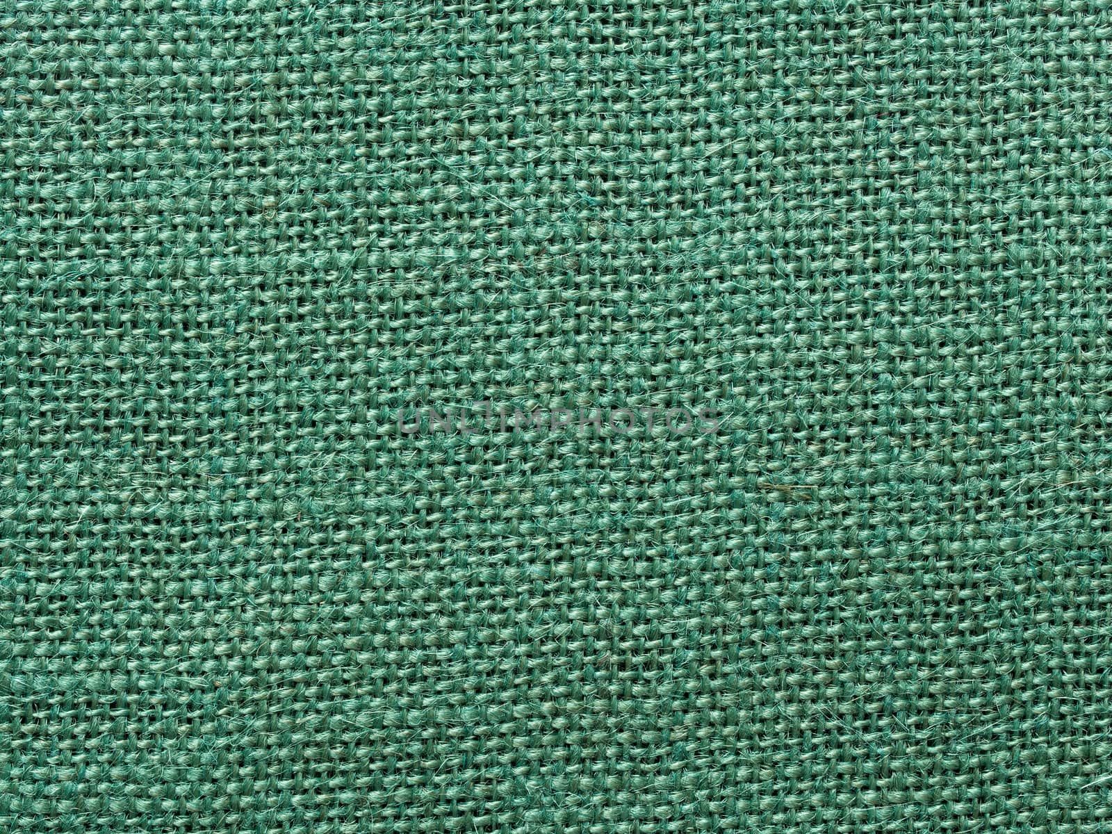 close up of green burlap fabric texture background