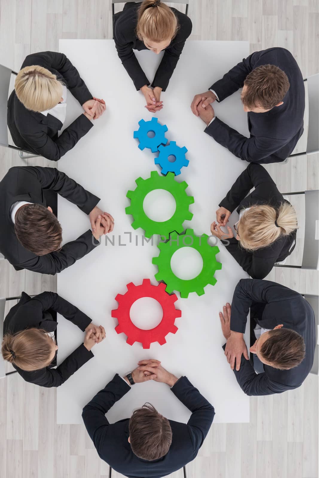 Teamwork with cogs of business by ALotOfPeople