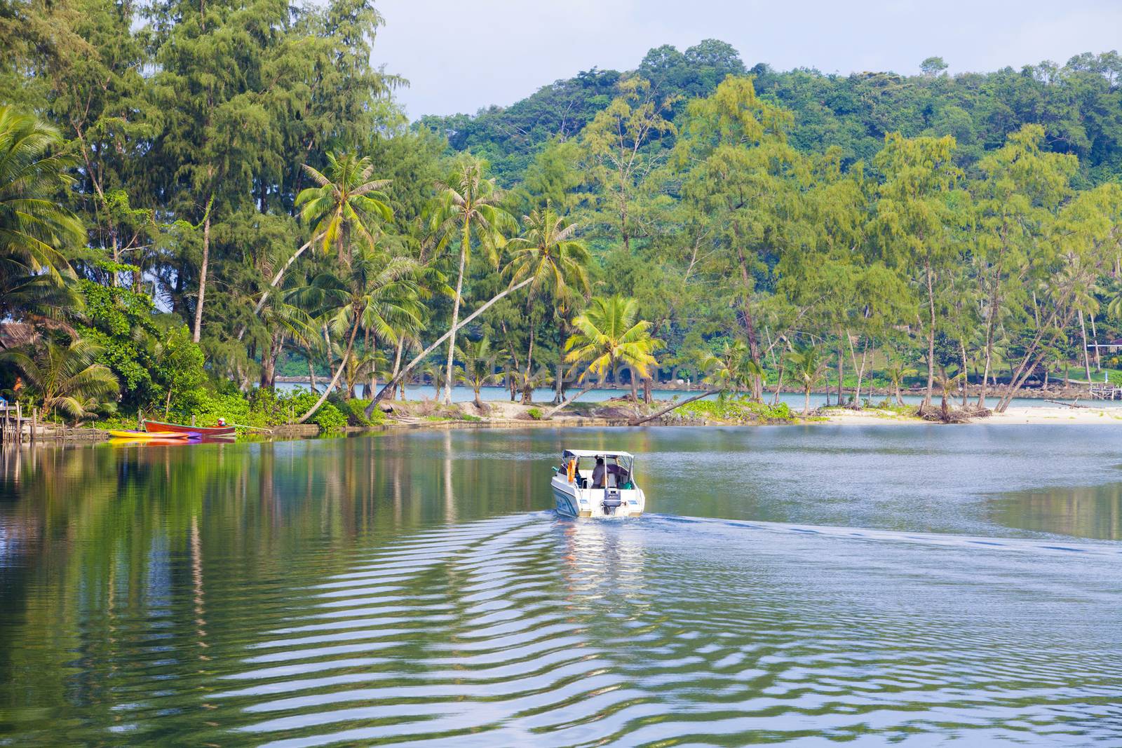 Natural beauty by the sea with boat traffic flow.