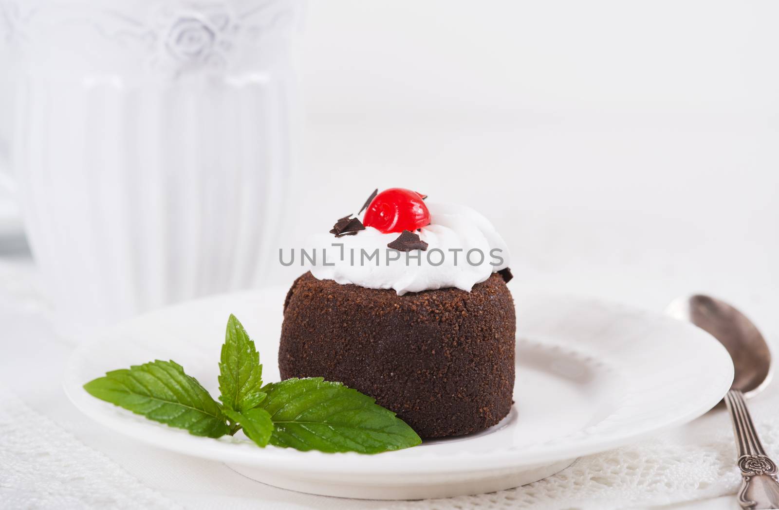 Chocolate sweet cake "Potato" on a plate on table, selective focus