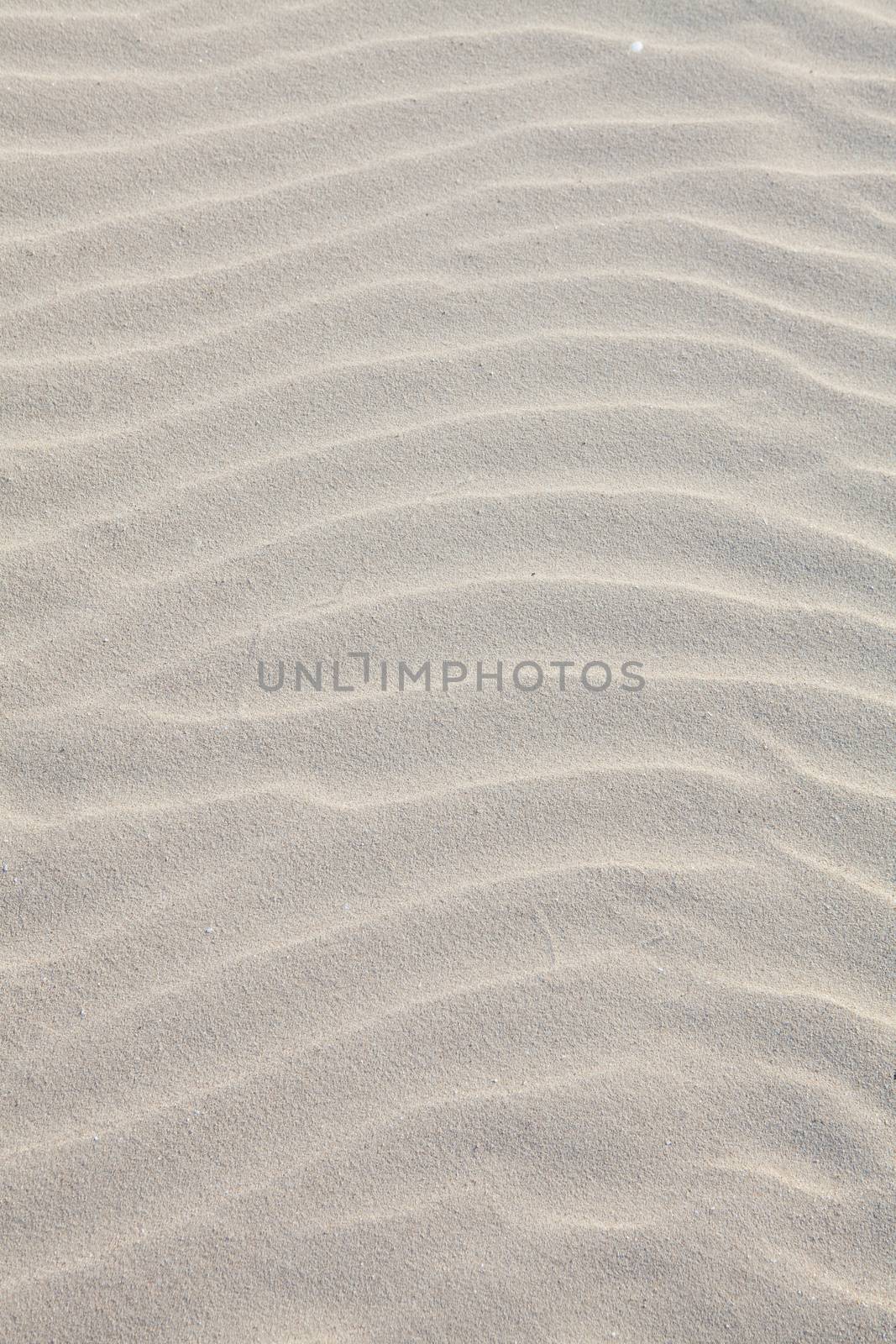 White sand beach, the waves,blurred texture backgrounds from sand