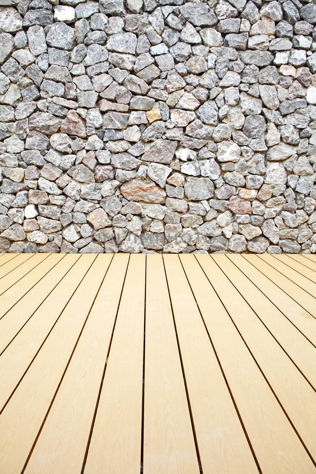Wooden floor and stone walls background,The rock walls and wooden floor.
