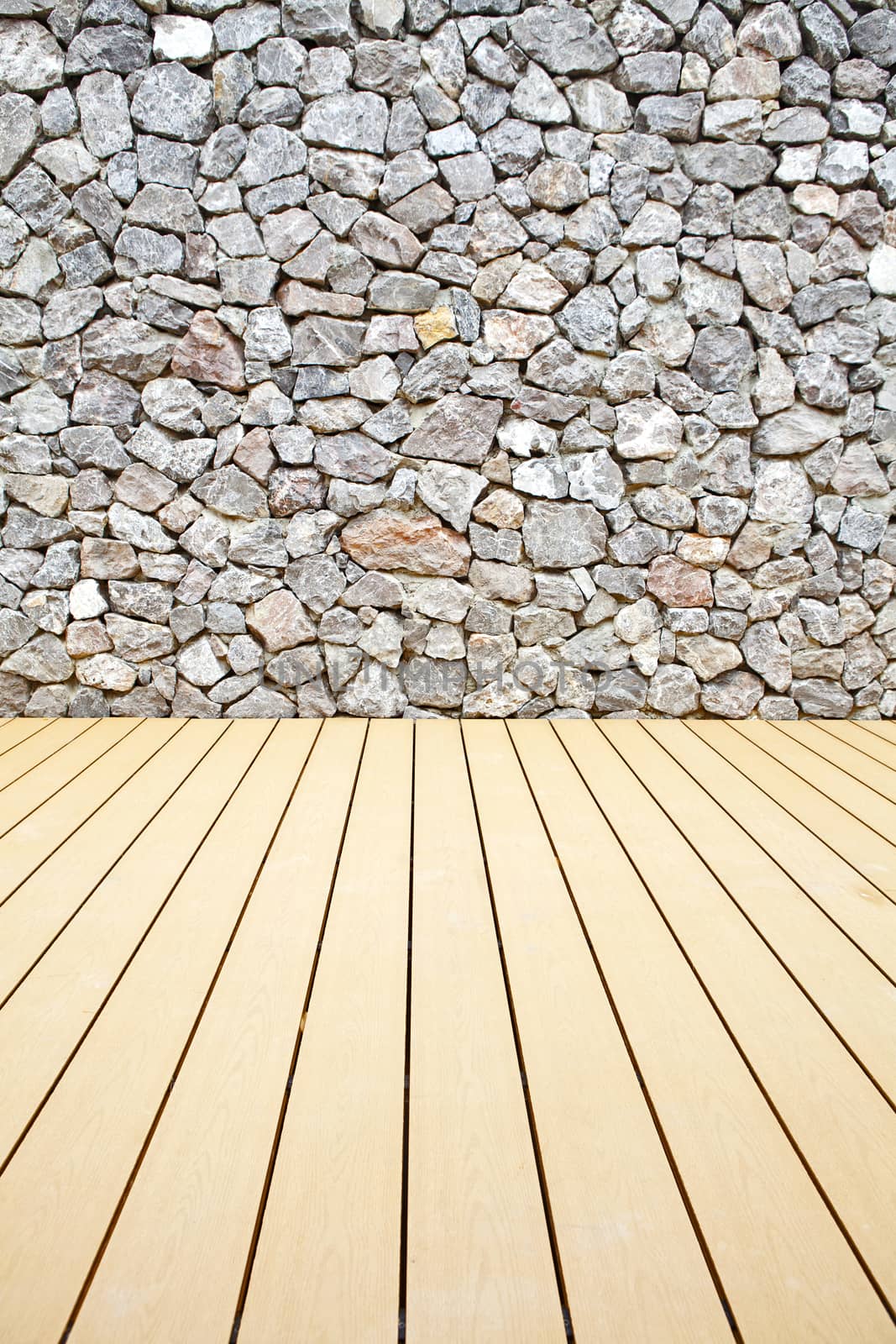 Wooden floor and stone walls background,The rock walls and wooden floor.
