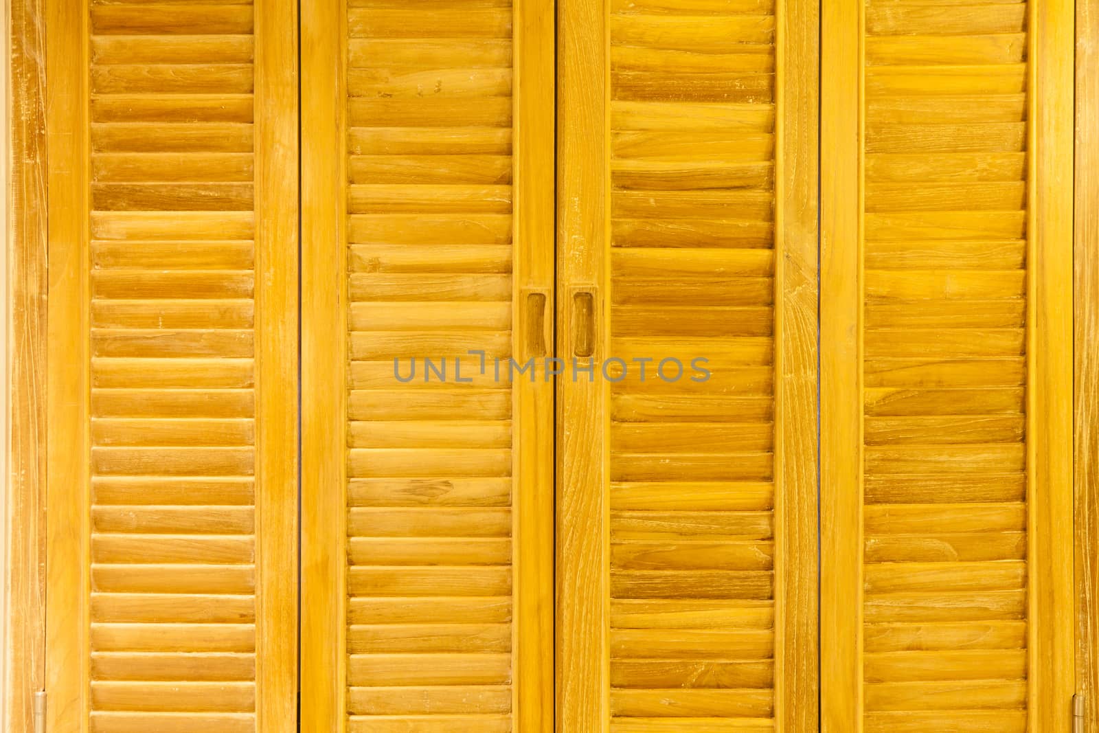 The walls are made of wood, a suitable background.