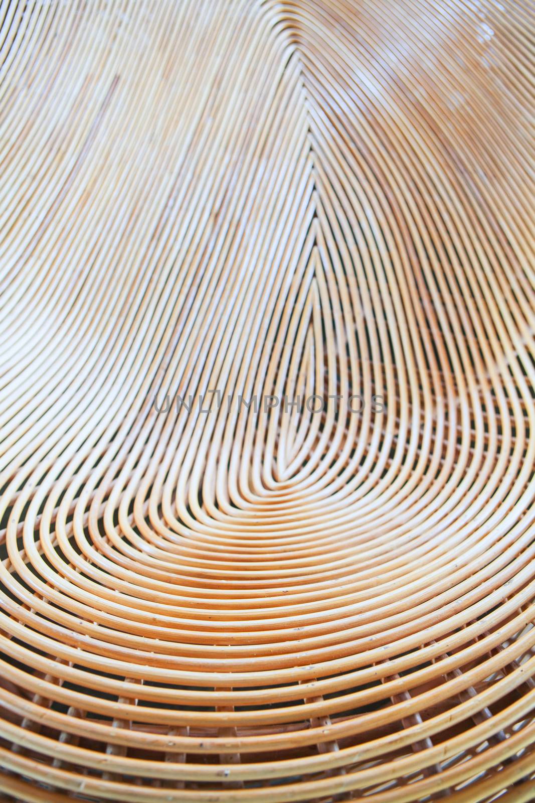 Cane or wickerwork background- showing the details of interlaced weave structure of basket or furniture,Abstract background from natural rattan. Handmade weaving.