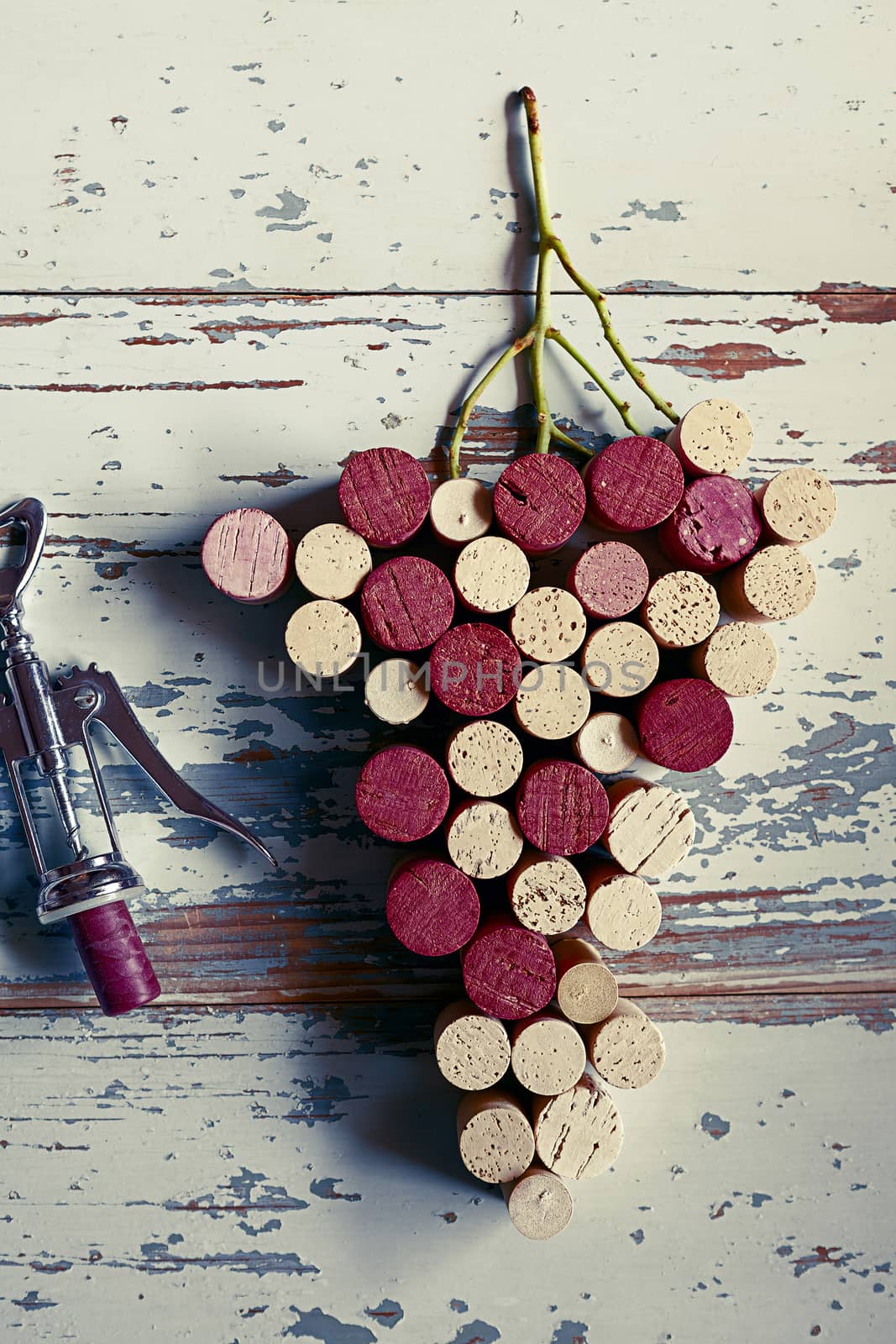 Corks grapes on wood background