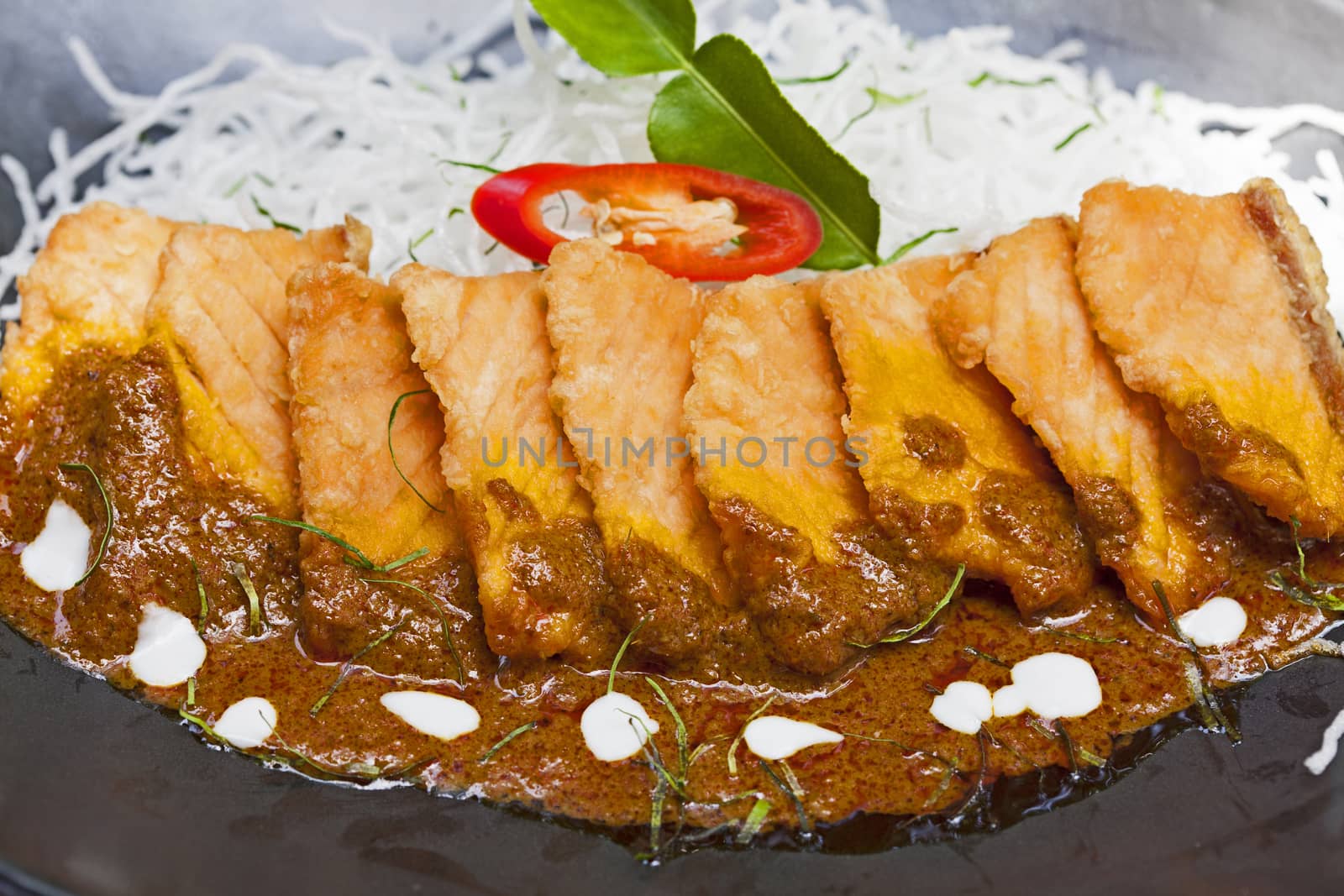 Salmon topped with chili cooking inThailand.