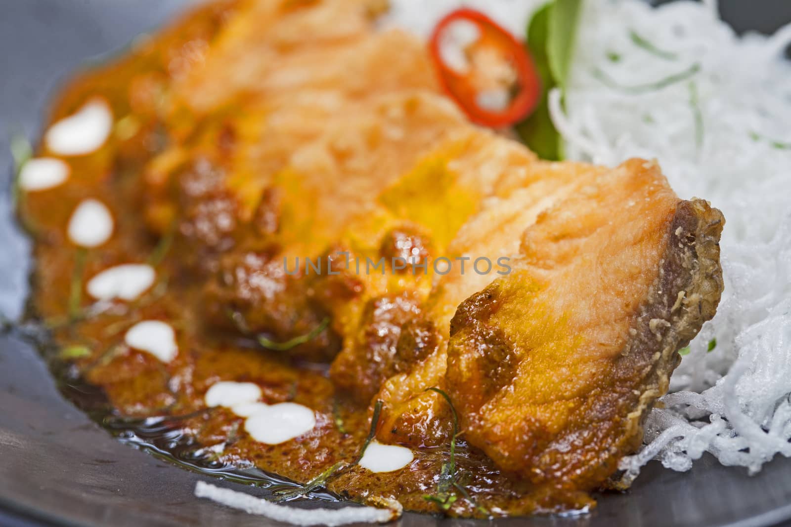 Salmon topped with chili cooking inThailand.