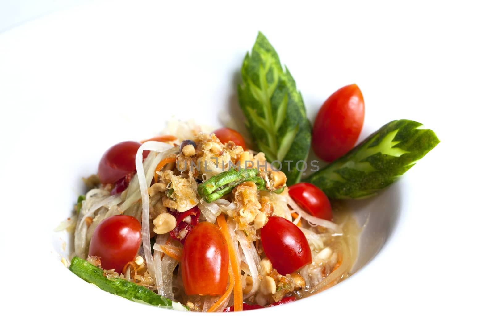 som tum thai served in white plate,Thai papaya spicy salad or know as Som Tum.
