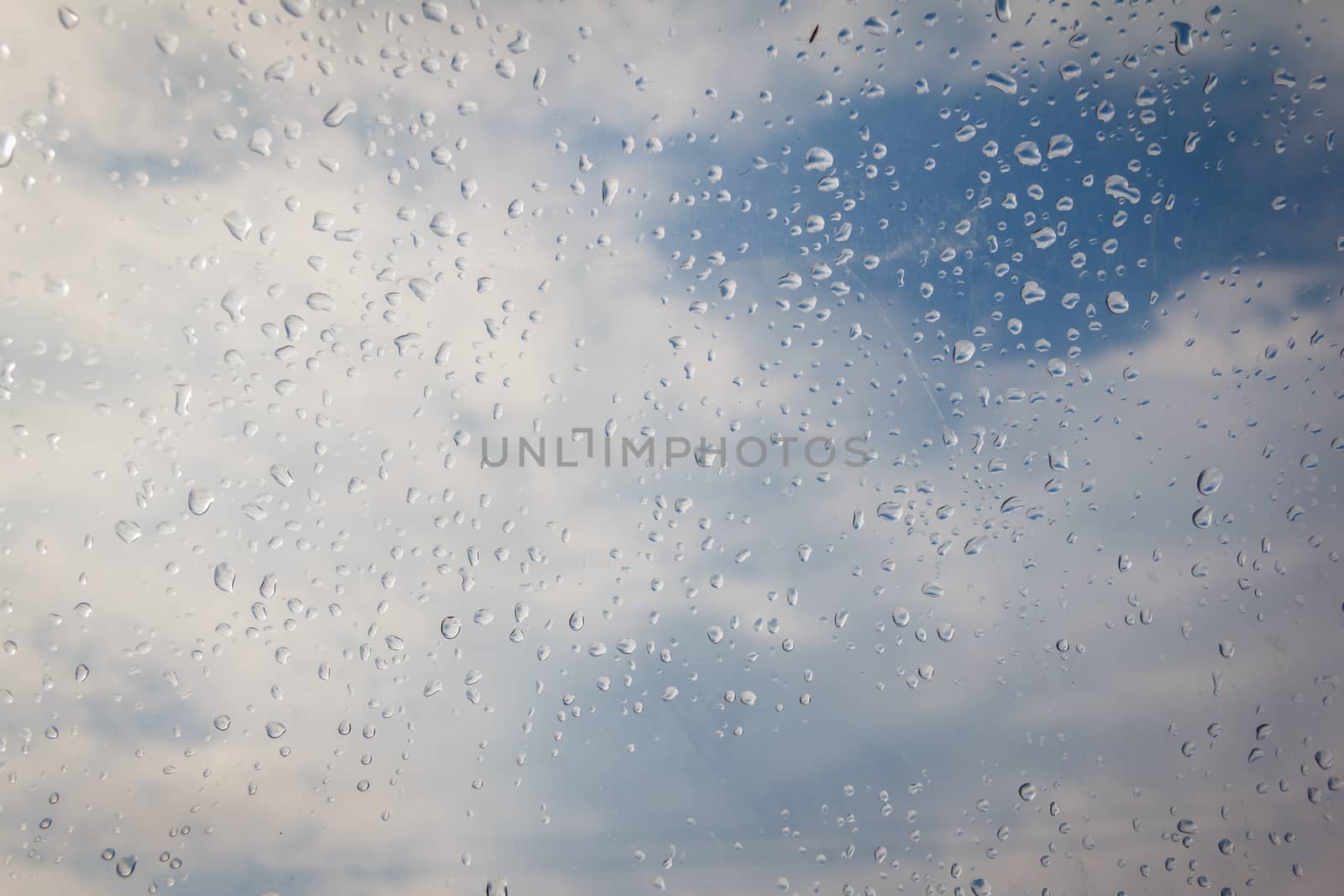 rain drop on the plastic roof with the sun light