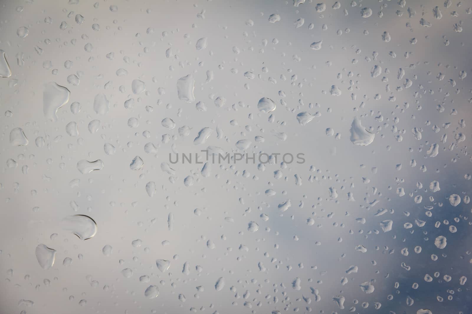 rain drop on the plastic roof with the sun light