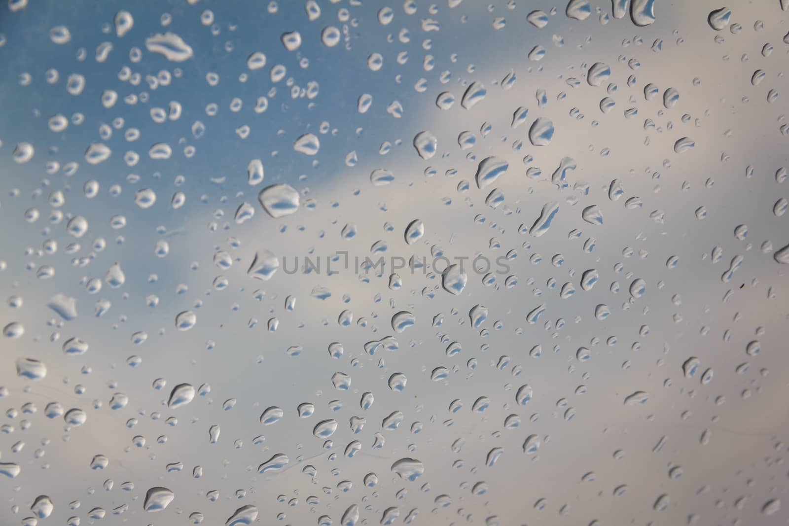 rain drop on the plastic roof with the sun light