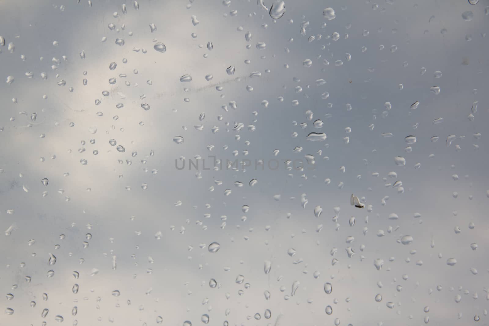 rain drop on the plastic roof with the sun light