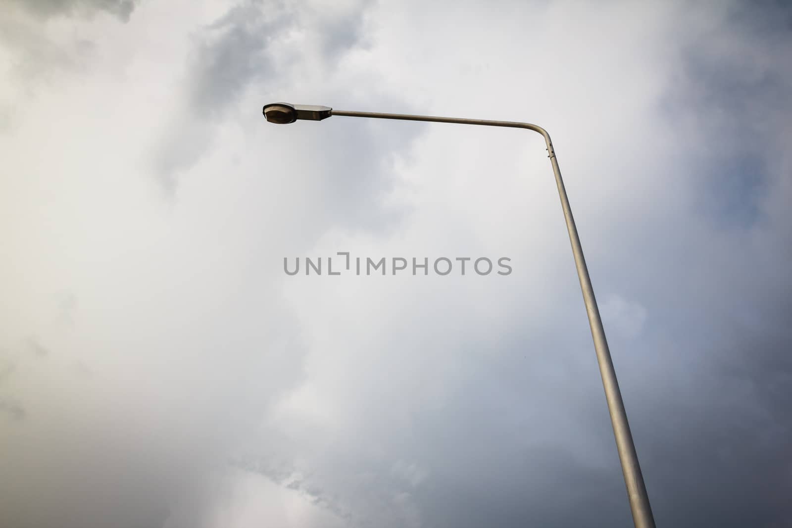 the lamp pole with dark clound ,background