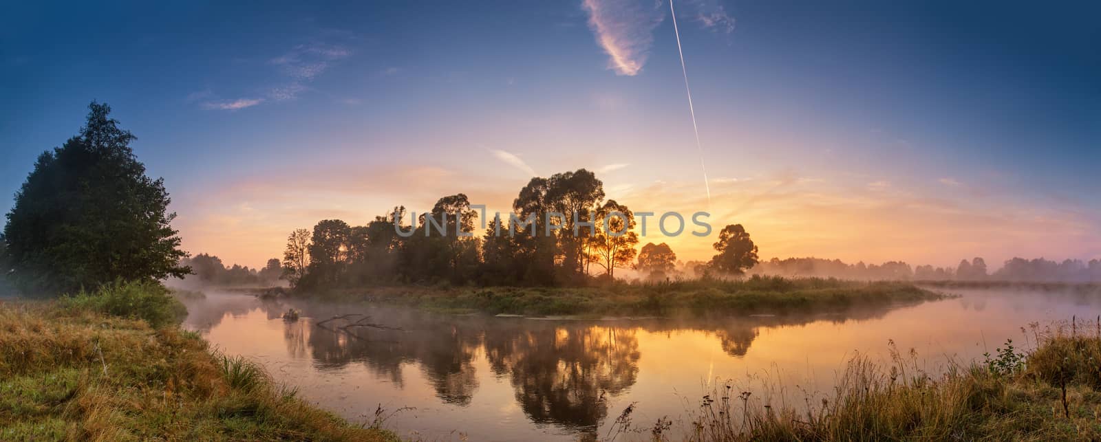 Foggy river in the morning. Panorama