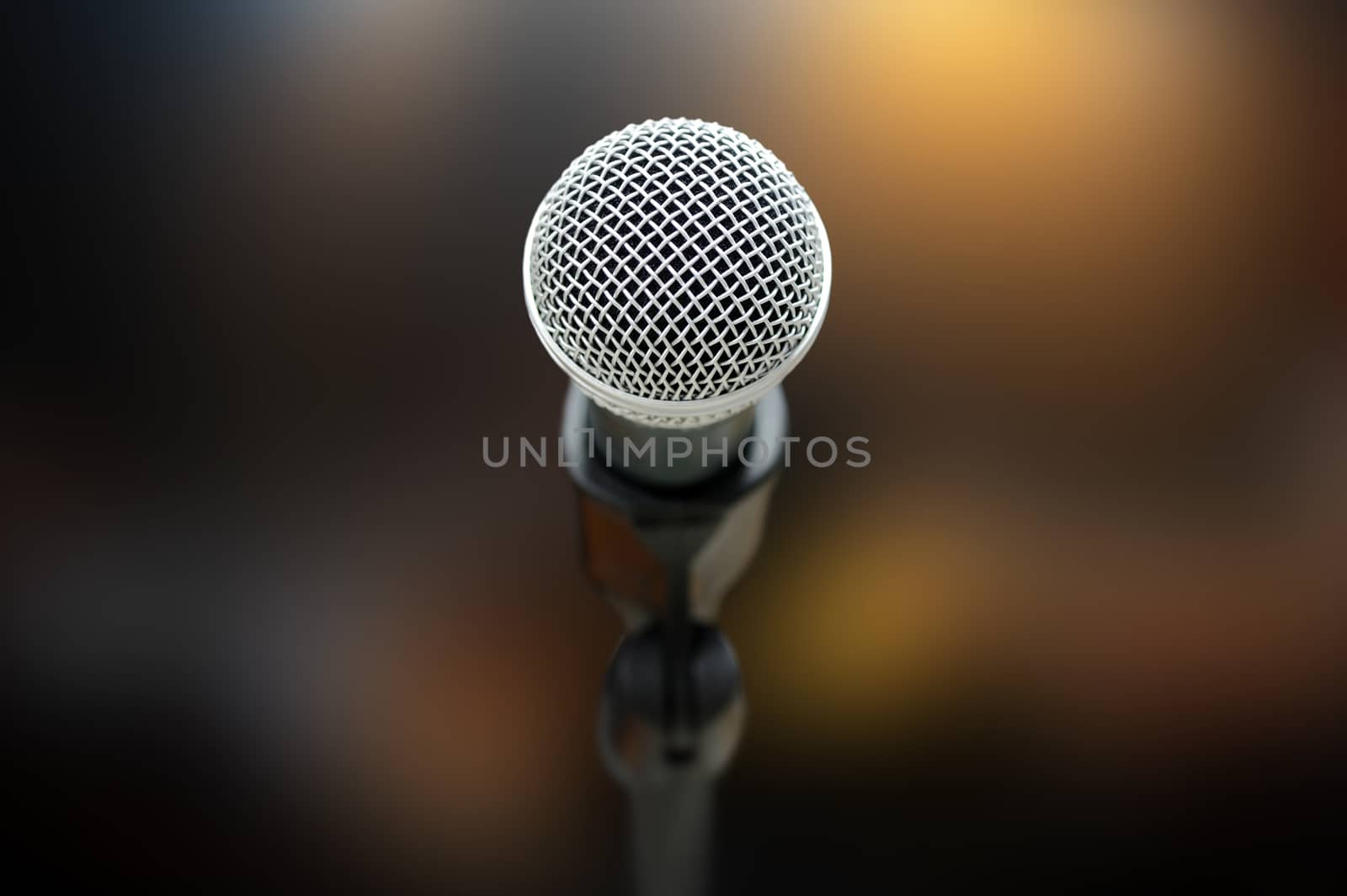 Close-up of microphone in concert hall or conference room
