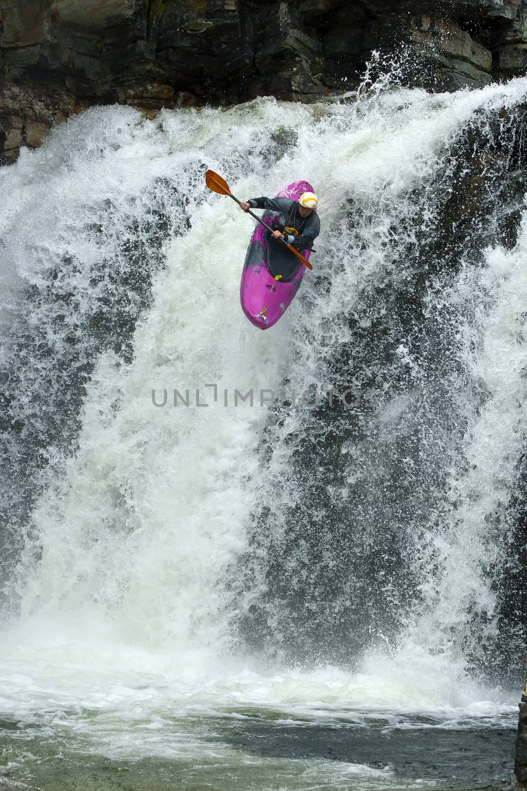 Kayaker in the waterfall in Norway, Ula river.