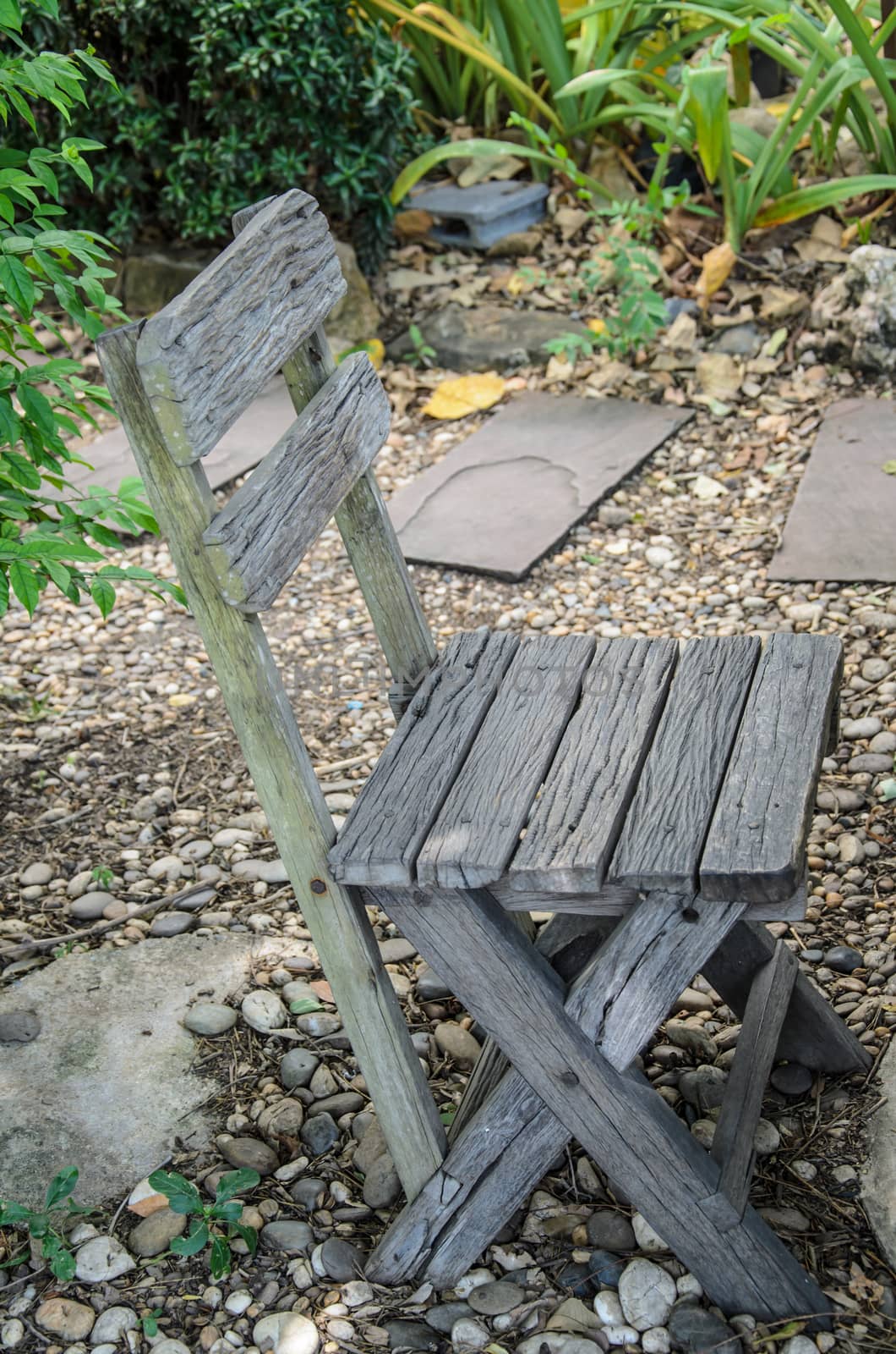 Old wooden chair sitting  in the garden