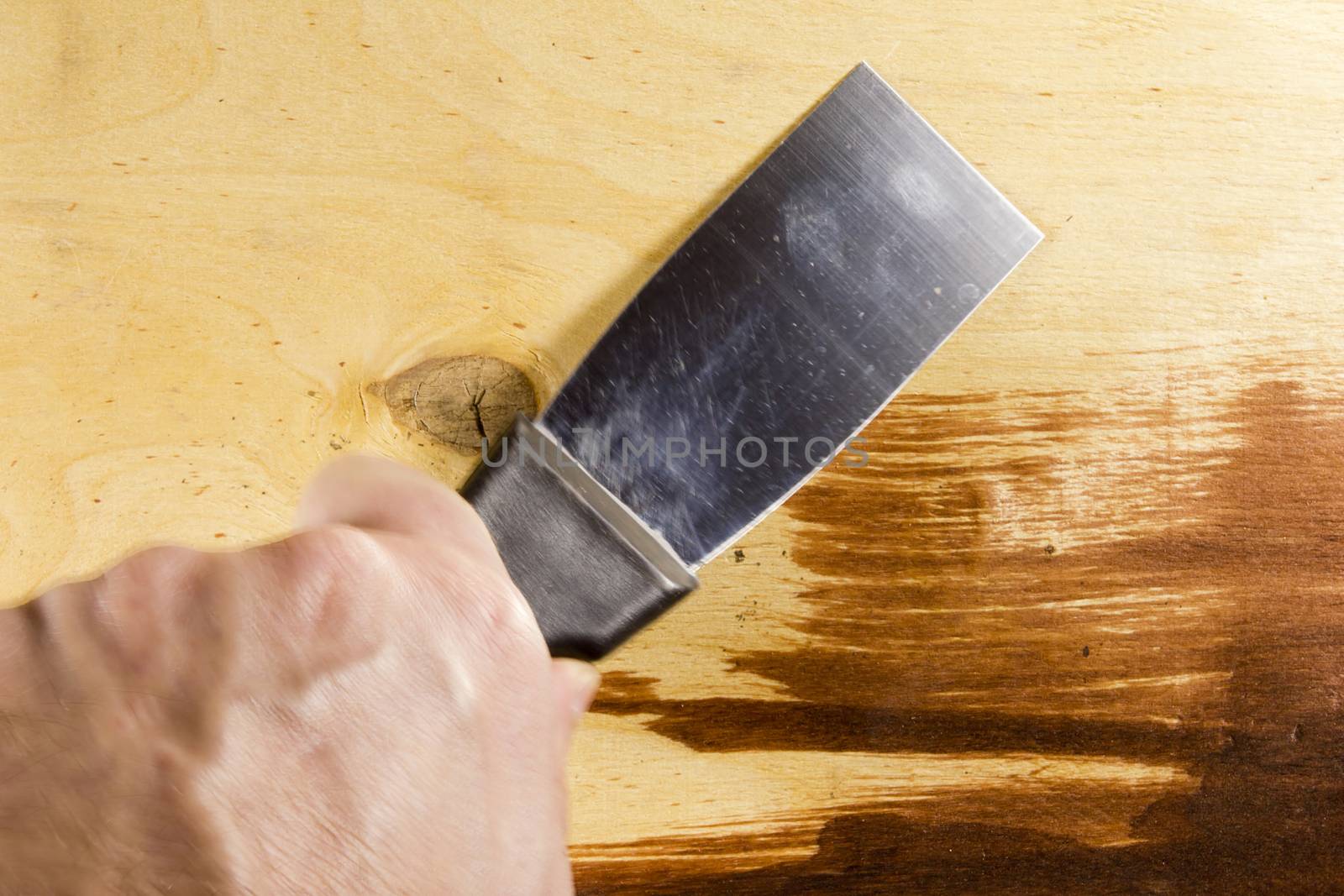 New metal spatula on the wooden background