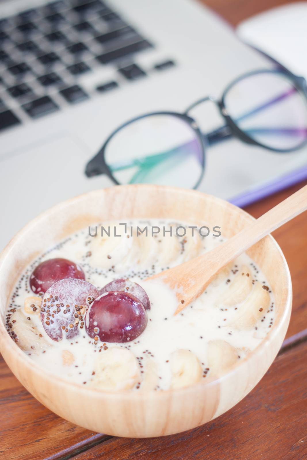 Granola with fruits on work station, stock photo