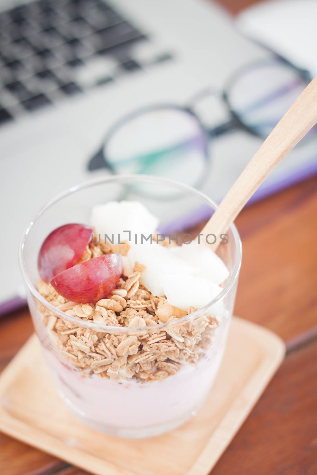 Granola with fruits on work station, stock photo