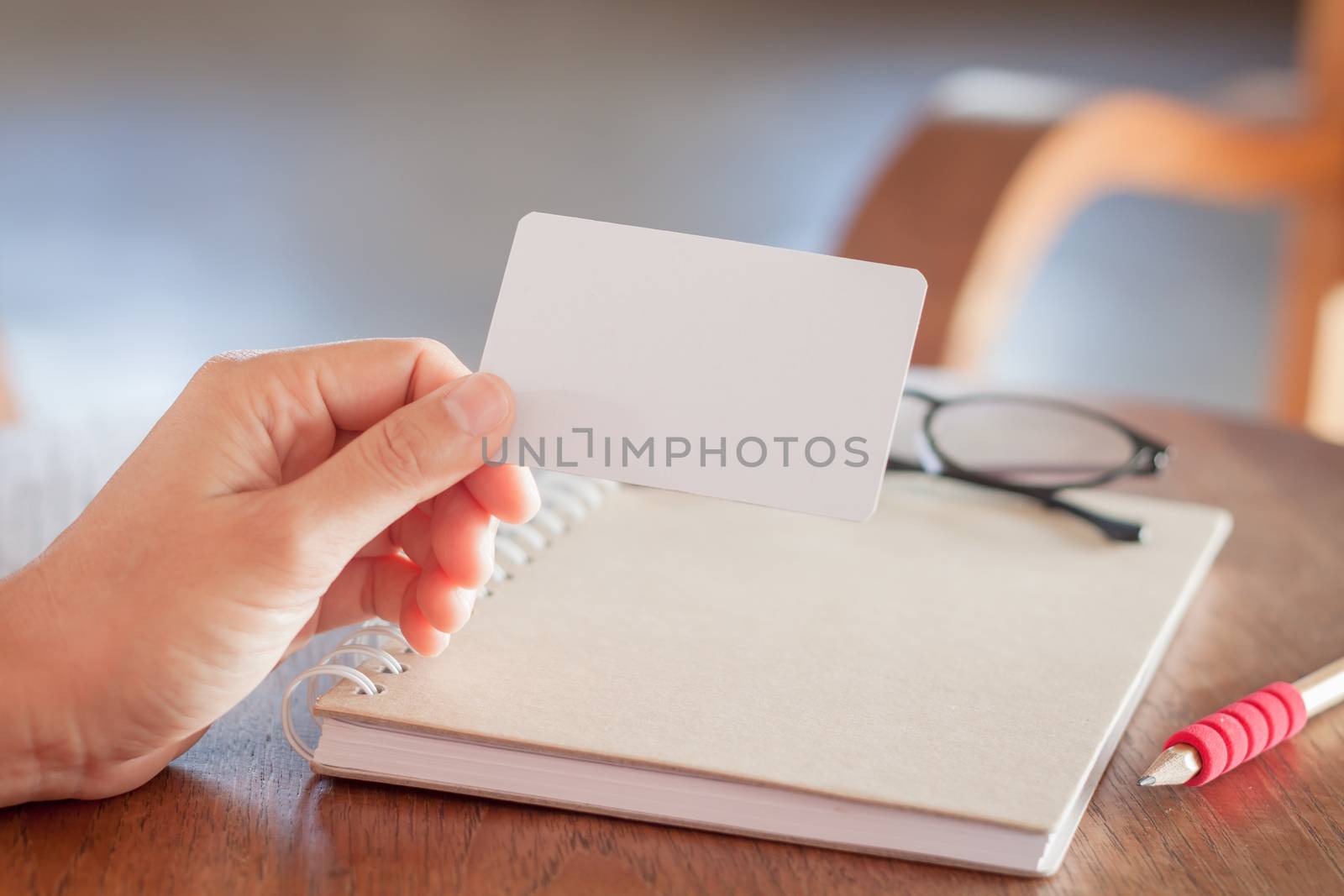 Woman hold blank business cards, stock photo