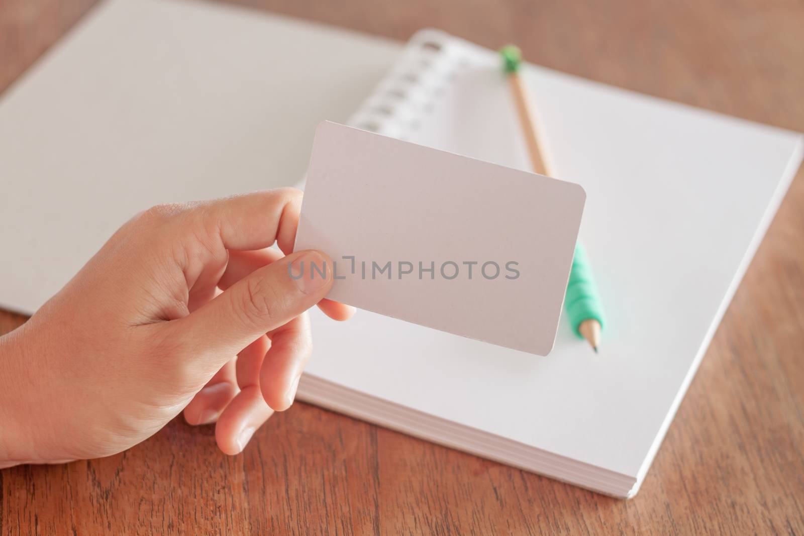 Woman hold blank business cards, stock photo