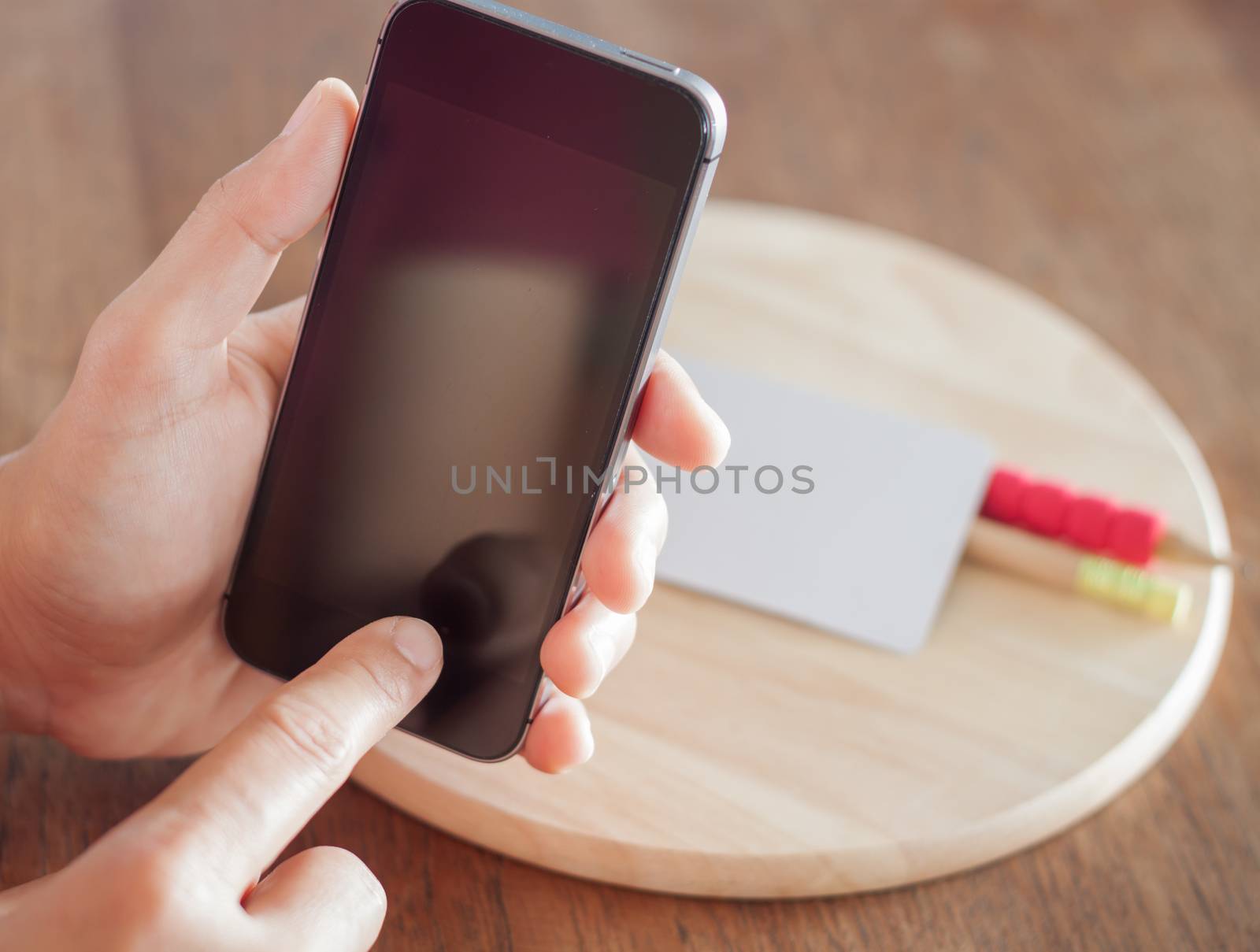 Smart phone in a woman's hand, stock photo