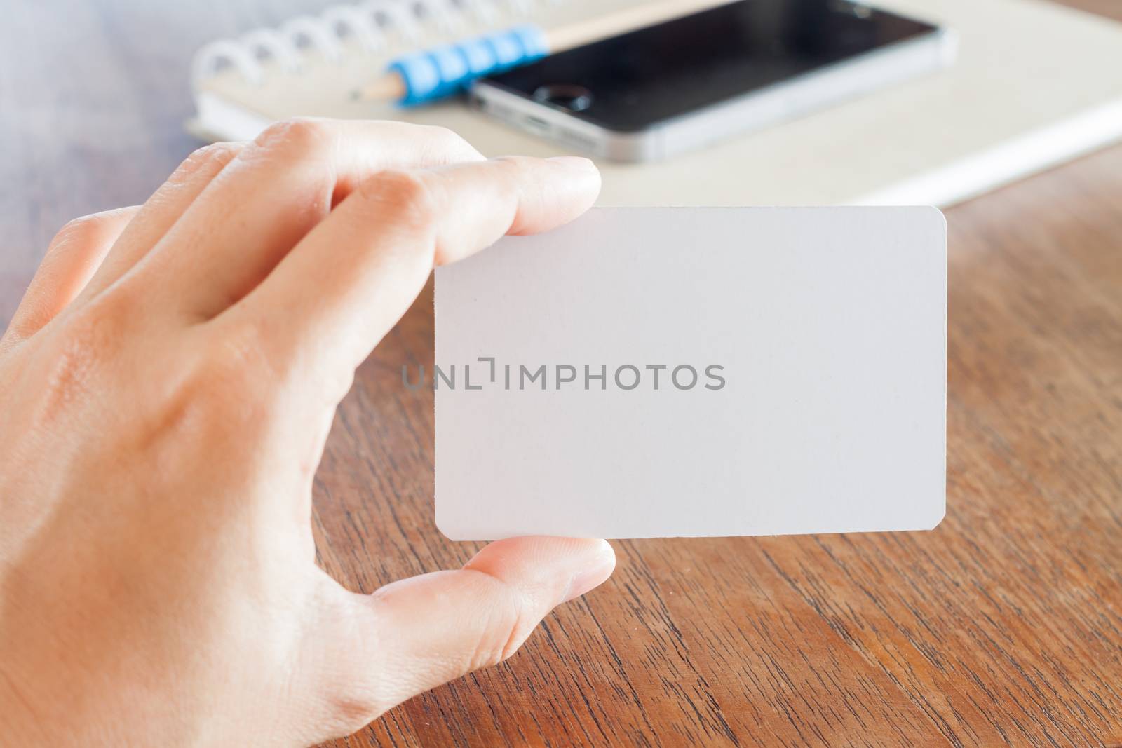 Woman hold blank business cards, stock photo
