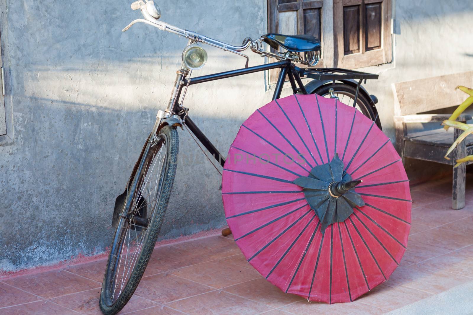 Retro bicycle with red umbrella, stock photo