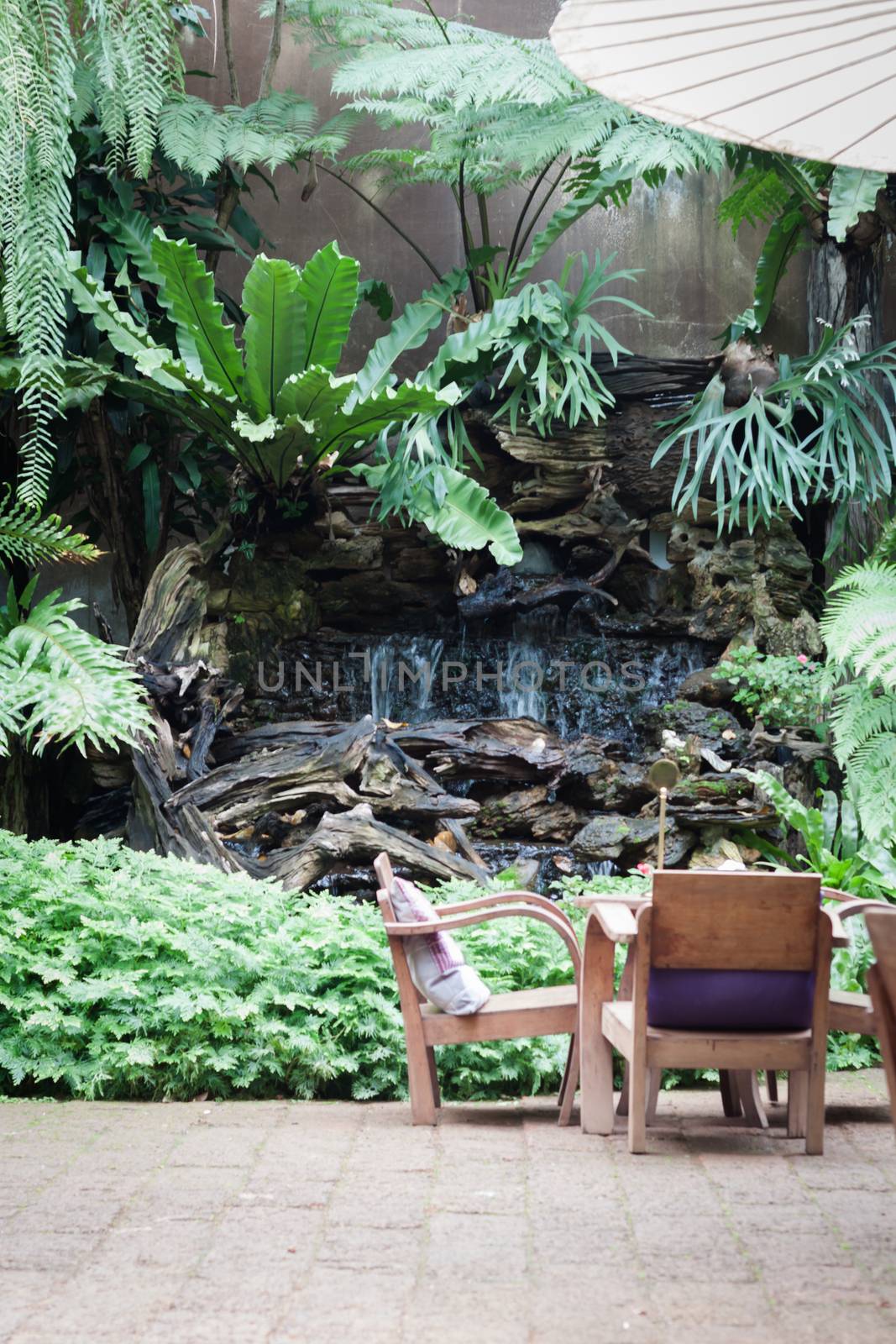 Wooden furniture decorated in garden, stock photo