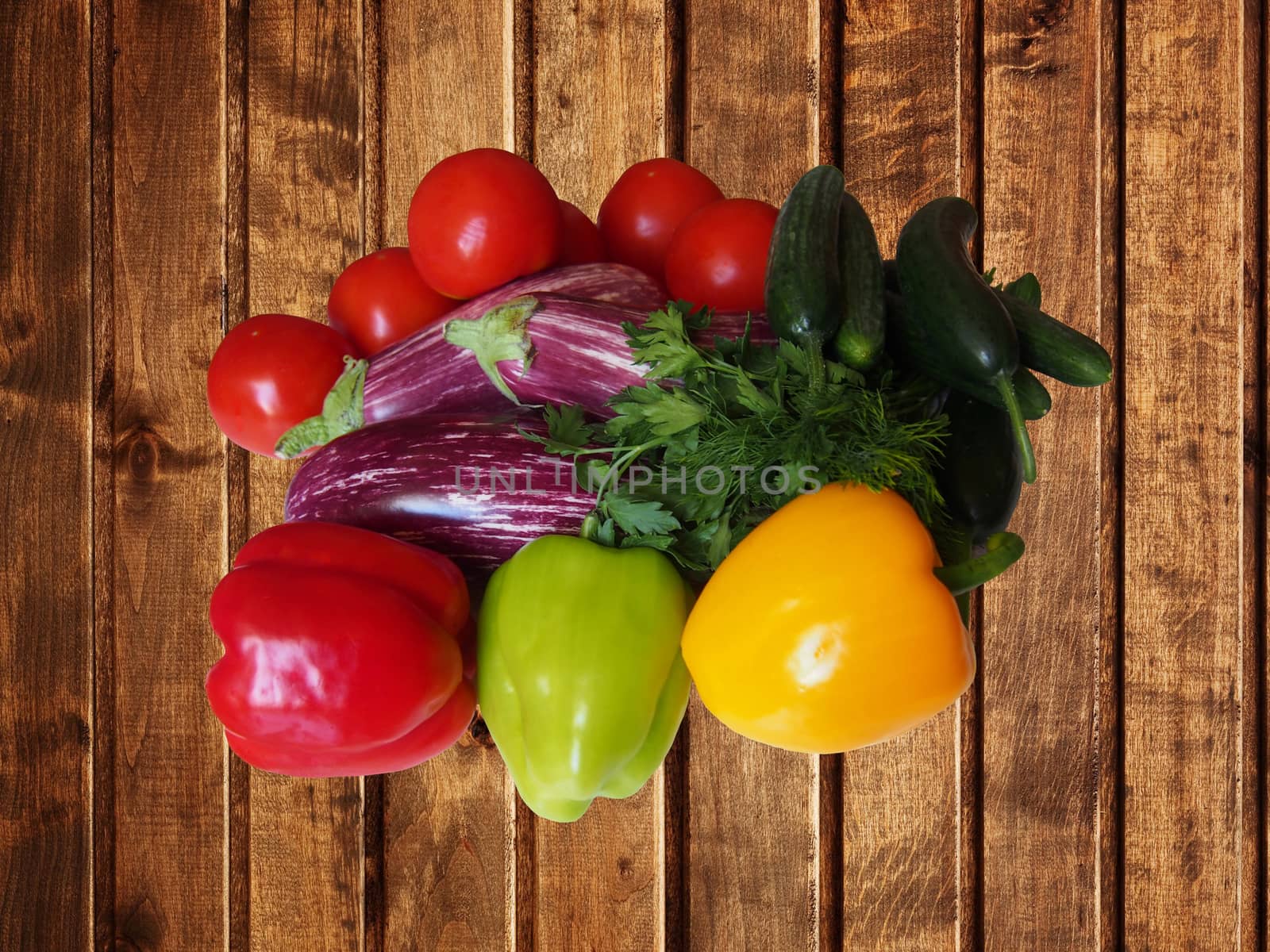Harvest vegetables, tomatoes, cucumbers, peppers, eggplant and other vegetables. Food still life
