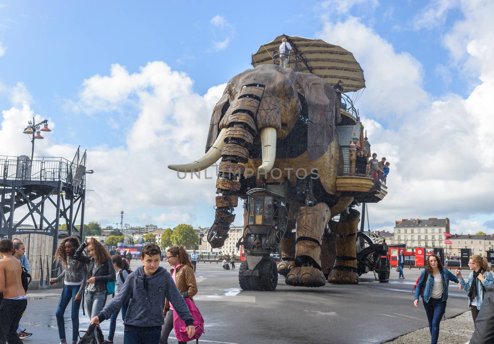 NANTES, FRANCE - CIRCA SEPTEMBER 2015: The Great Elephant goes for a walk with passengers aboard.
