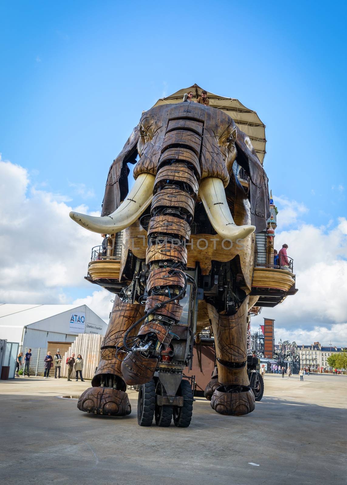 NANTES, FRANCE - CIRCA SEPTEMBER 2015: The Great Elephant goes for a walk with passengers aboard.