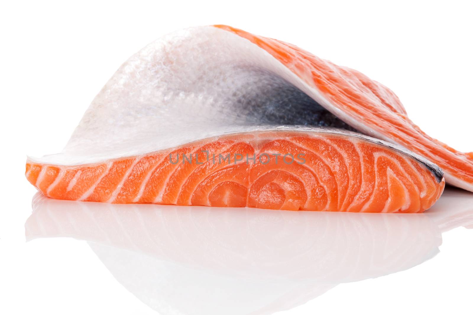 Big fresh raw salmon piece isolated on white background. Luxurious healthy seafood eating. 