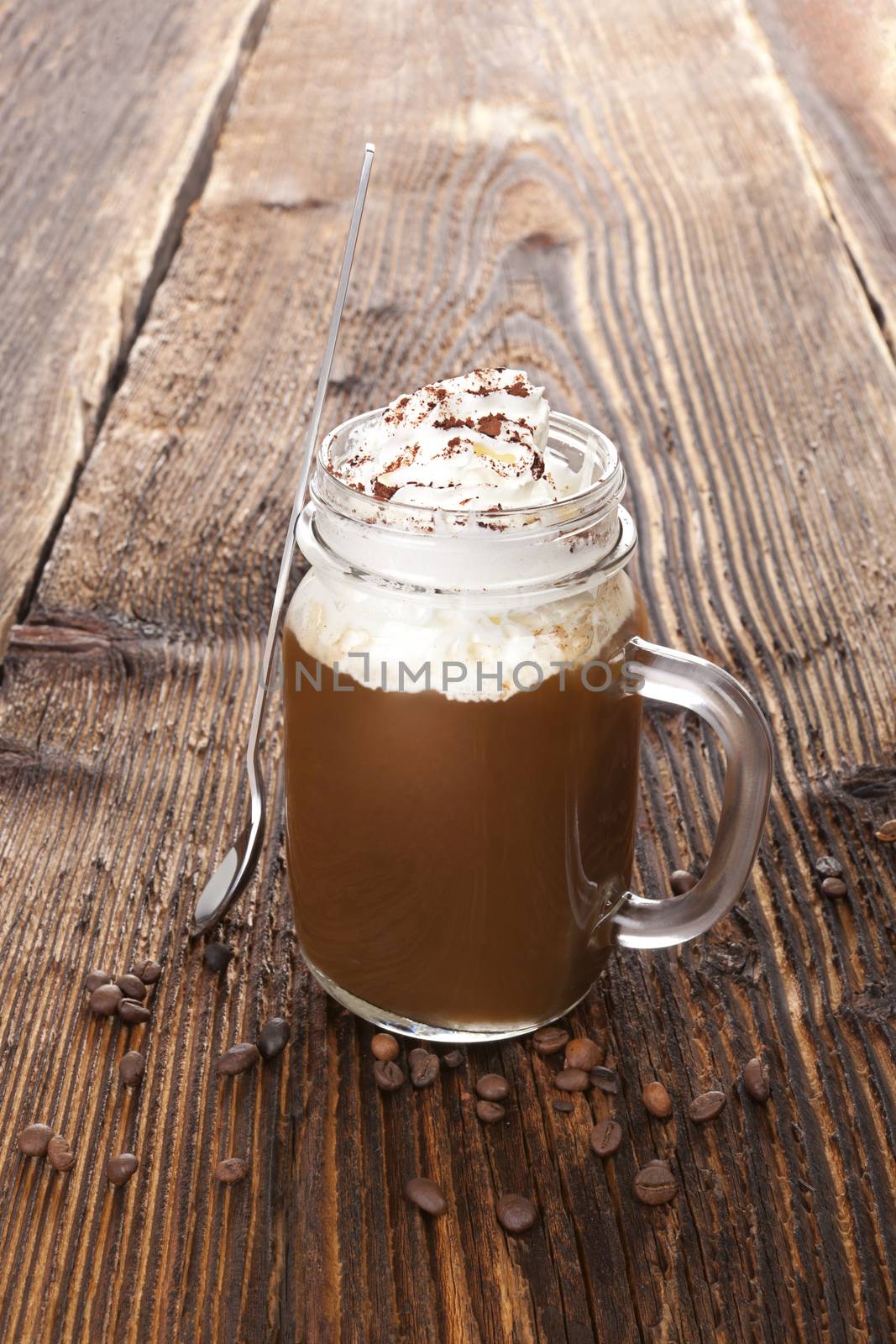 Hot chocolate on wooden table. Delicious cocoa drink.