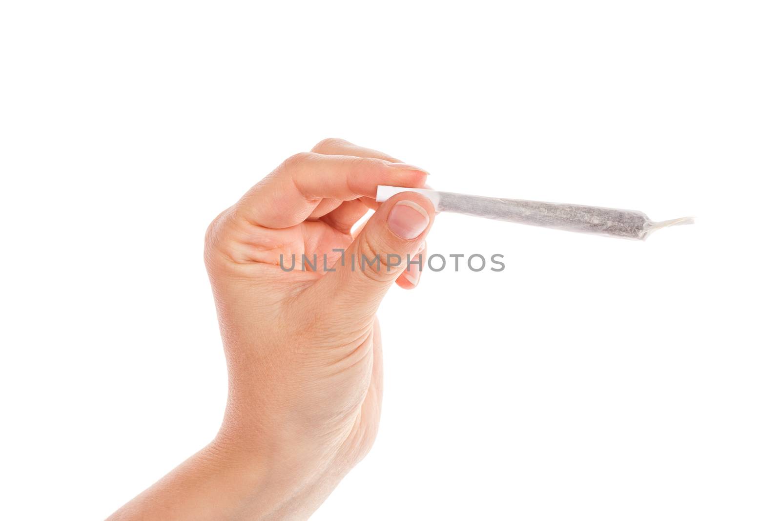 Female hand holding cannabis joint isolated on white background. Medical marijuana.