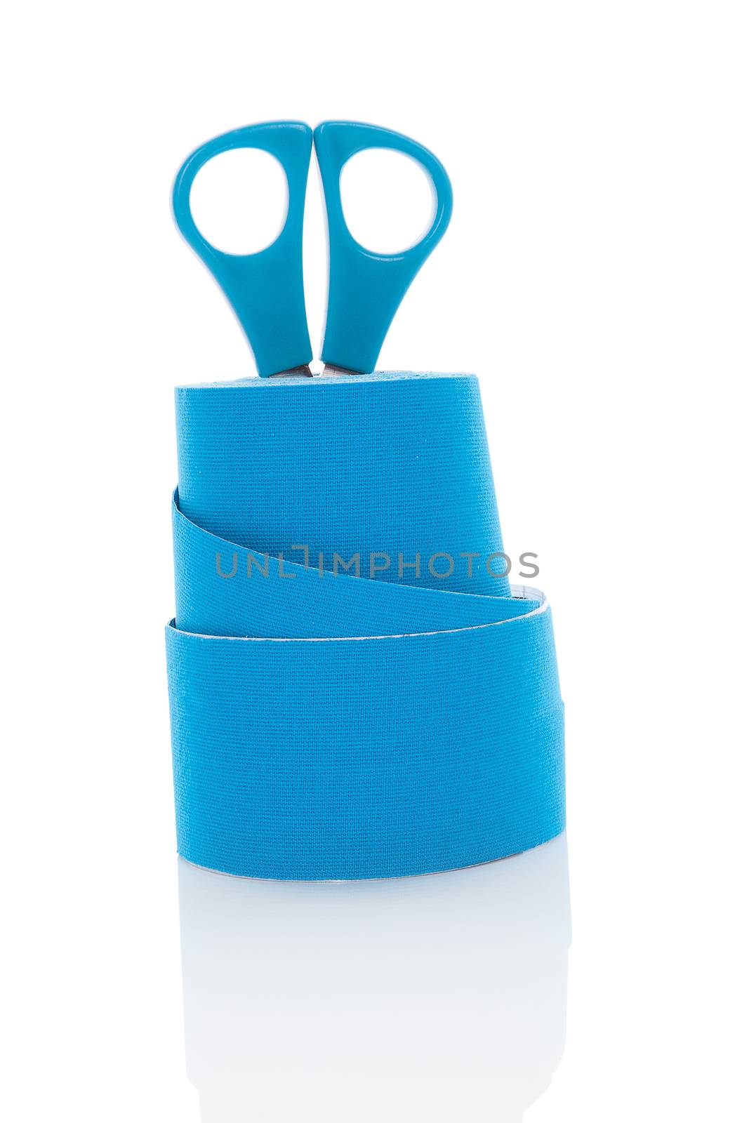 Kinesiotape with scissors isolated on white background. Alternative medicine. 