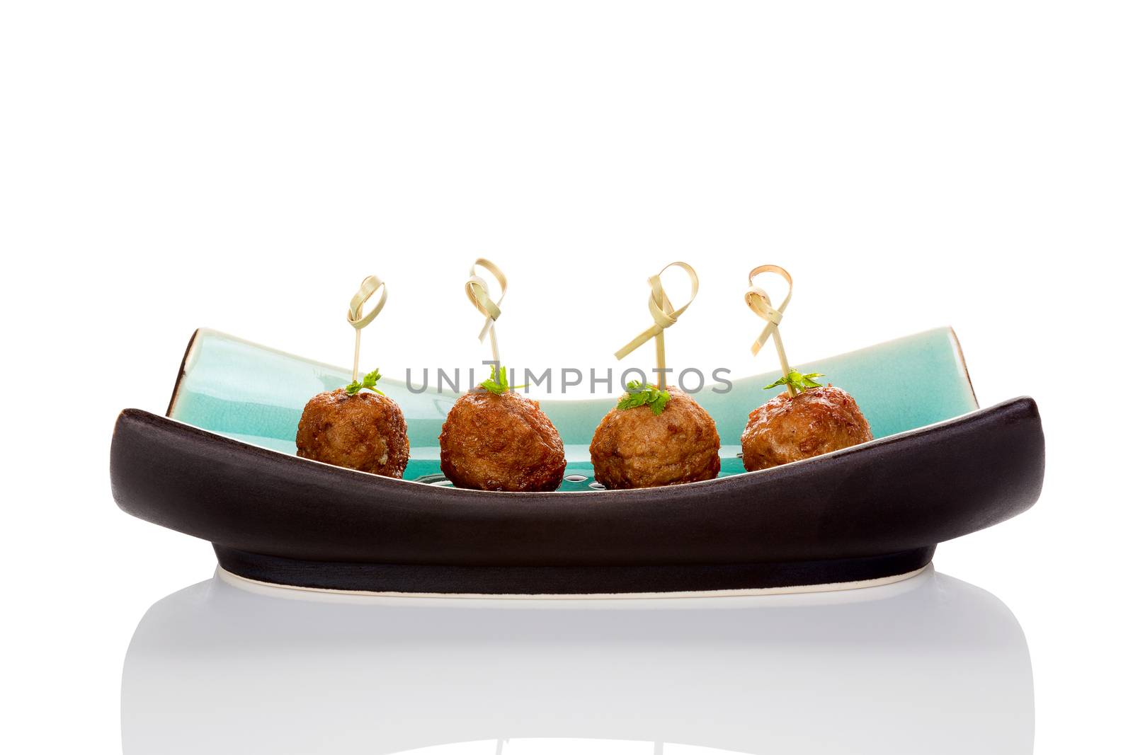 Meatballs canape on ceramic tray isolated on white background. Culinary bbq eating. 