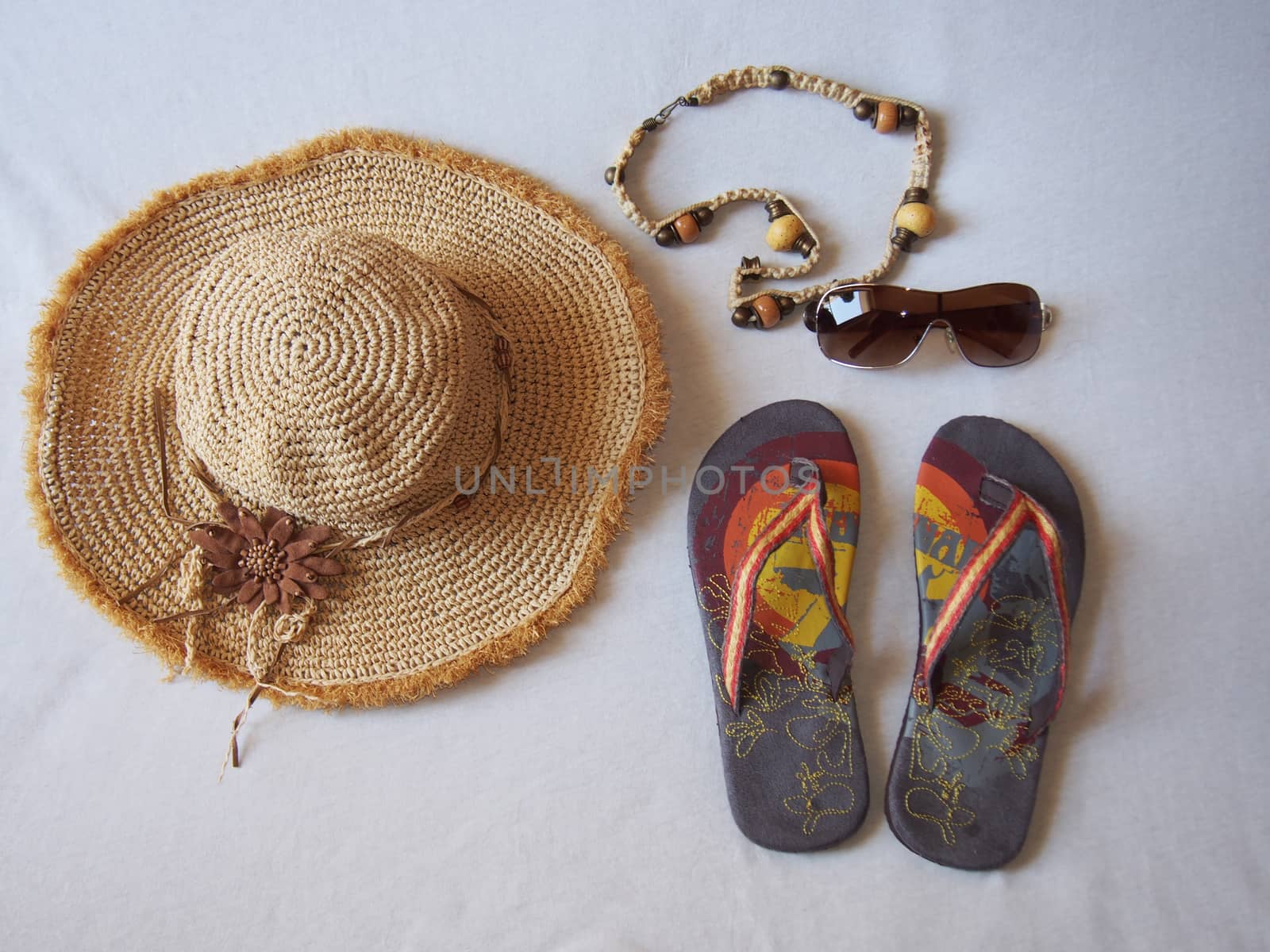 a good plot for a beach site hat sandals sunglasses jewelery