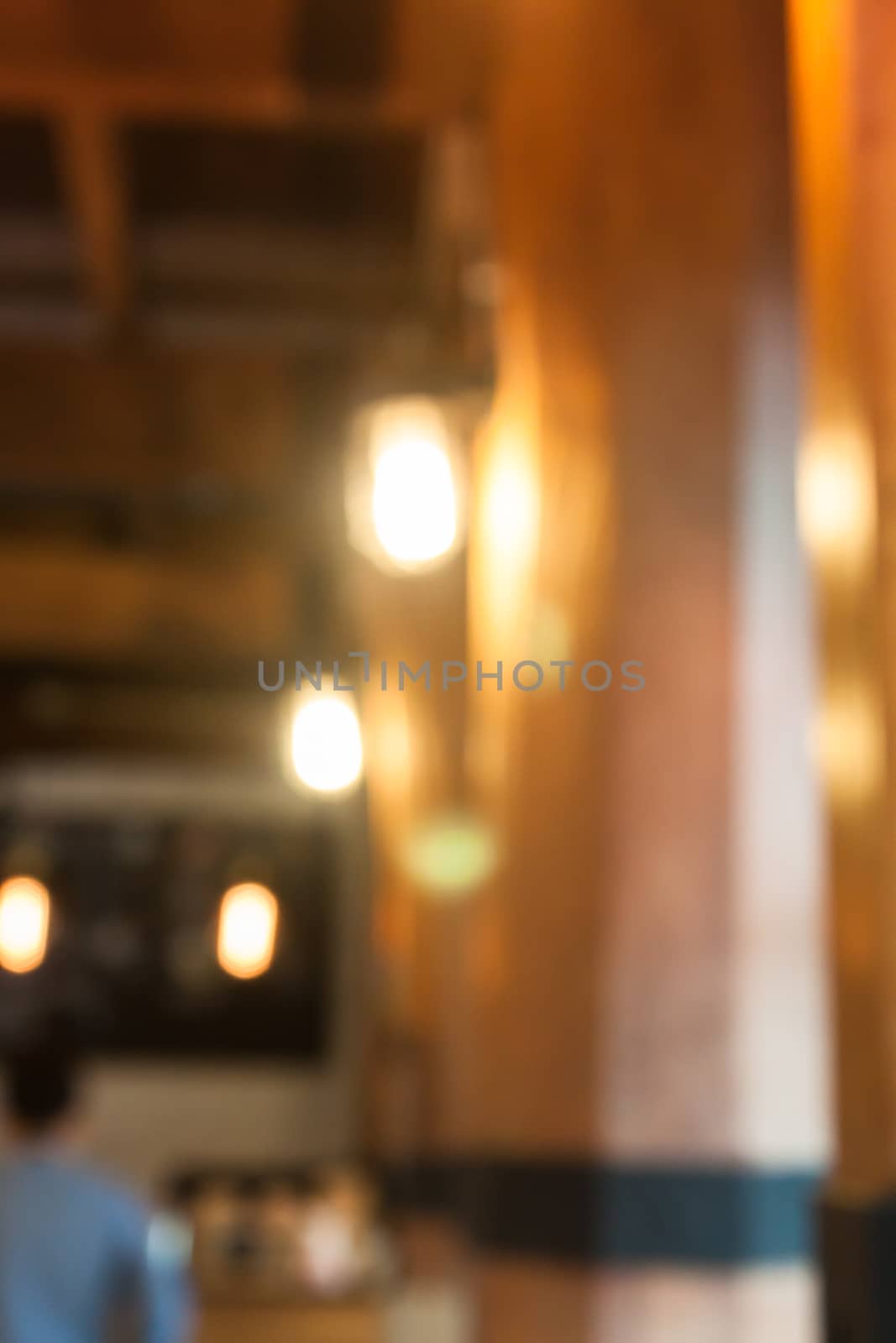 Warm lighting lamps on ceiling in coffee shop, stock photo