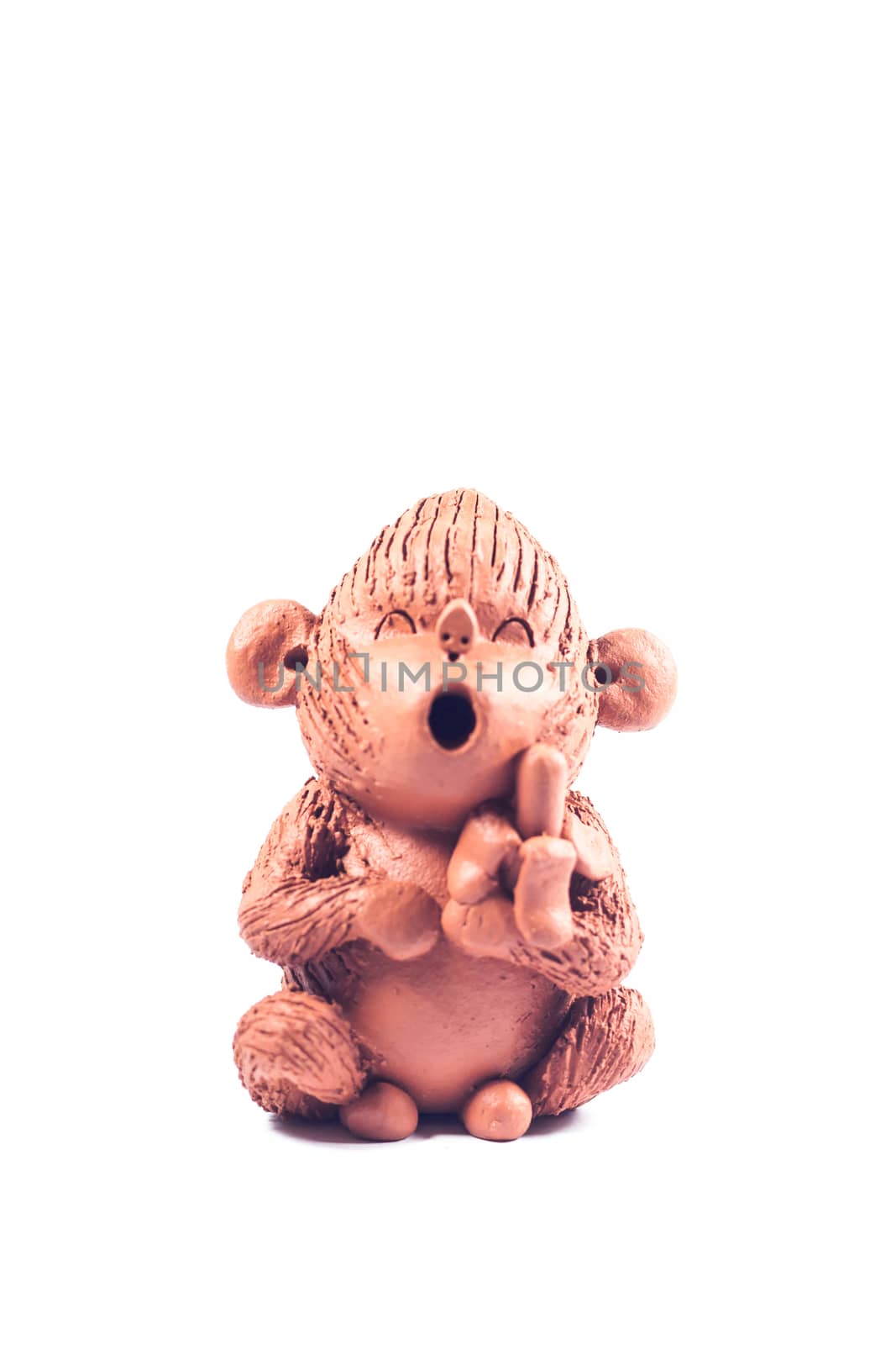 Close-up monkey clay doll isolated on white background, stock photo