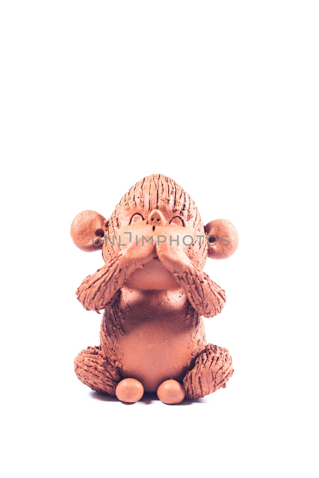 Close-up monkey clay doll isolated on white background, stock photo