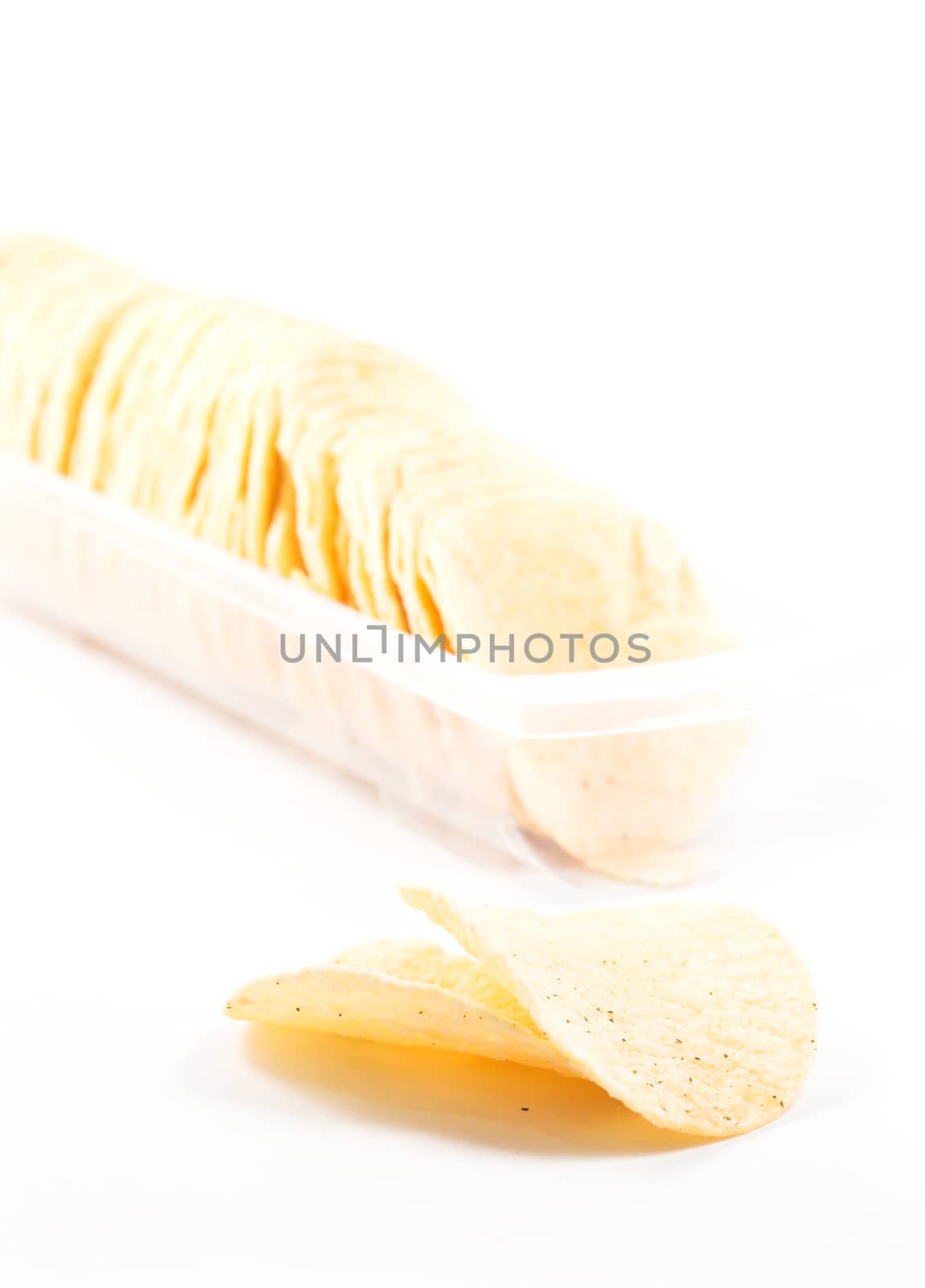 Potato chips on white background by punsayaporn