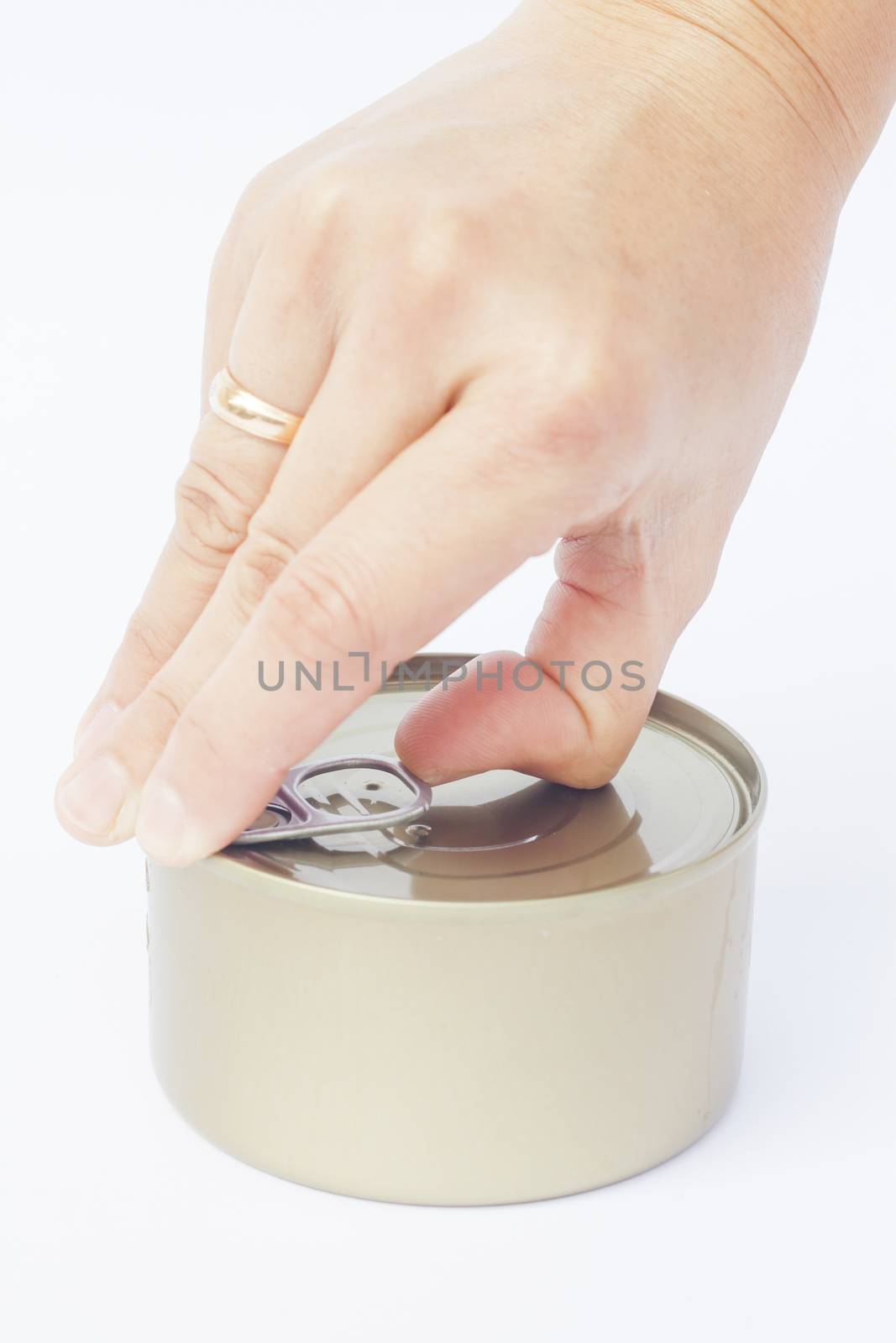 Close-up tin can with hand isolated on white background  by punsayaporn