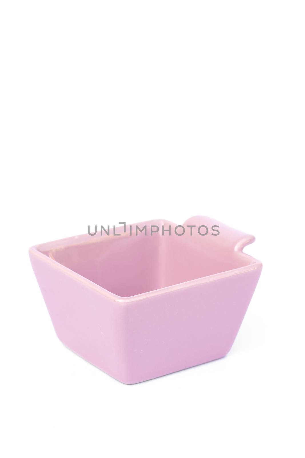 Pink ceramic bowl isolated on white background, stock photo