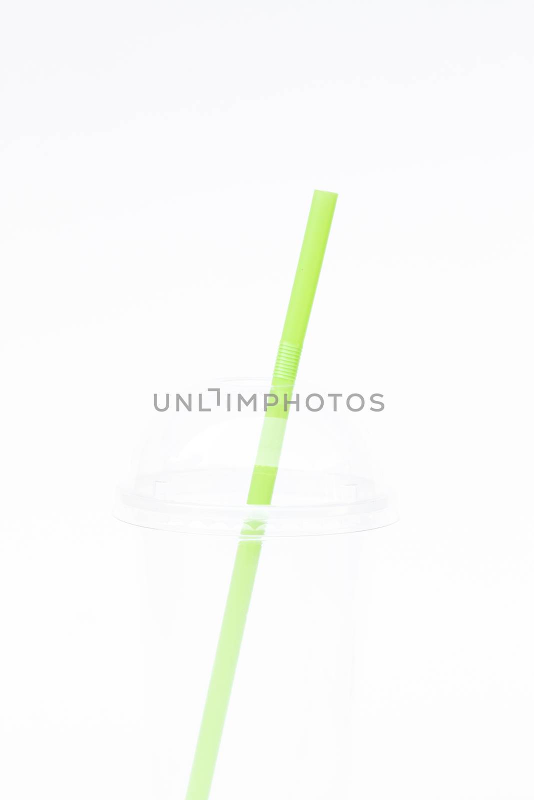 Empty plastic cup with straw isolated on white background, stock photo