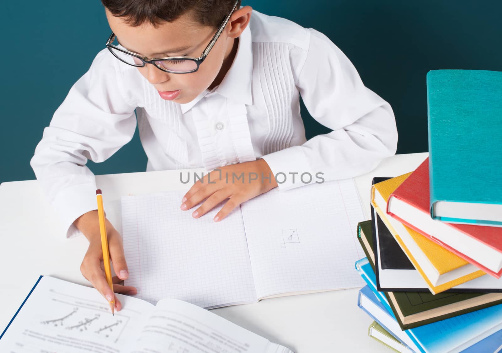 Pensive cute boy with homework sitting by kzen