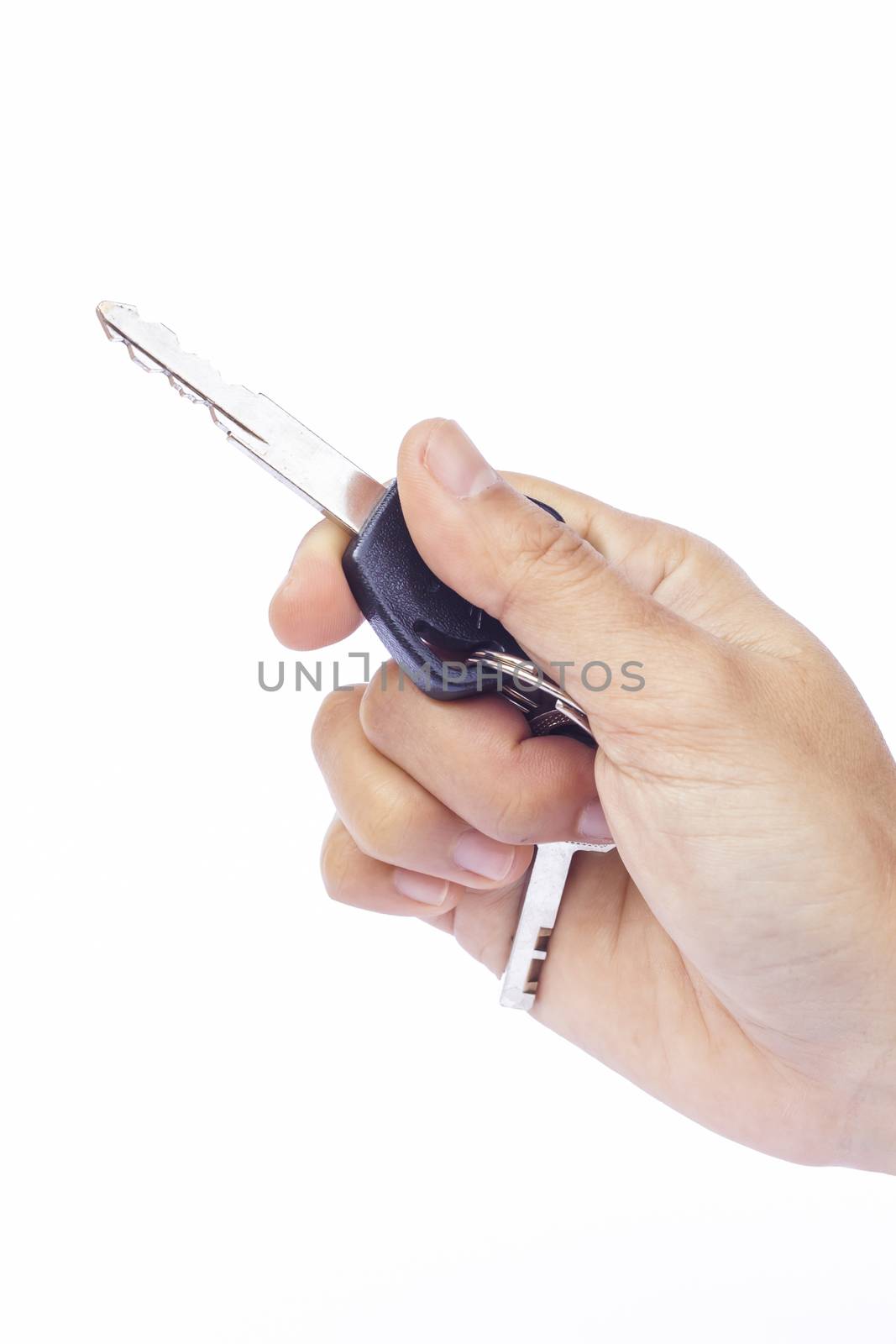 Hand with a car key isolated on white background, stock photo